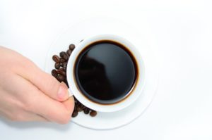 holding cup of coffee 