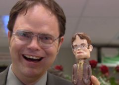 man holding bobbleheads
